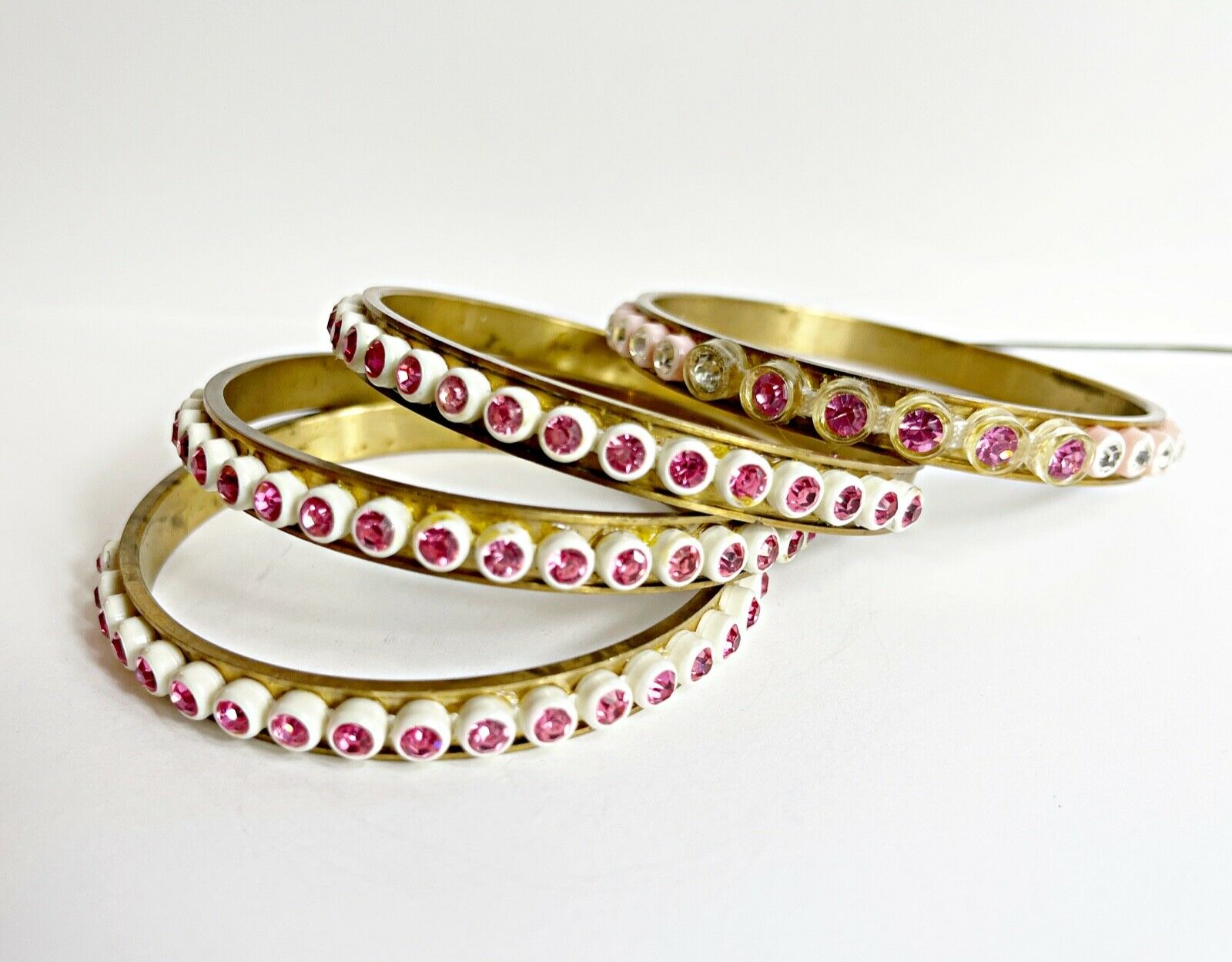 Vintage Brass Bangle Bracelet Stack With Different Vintage Pink Rhinestone Trim